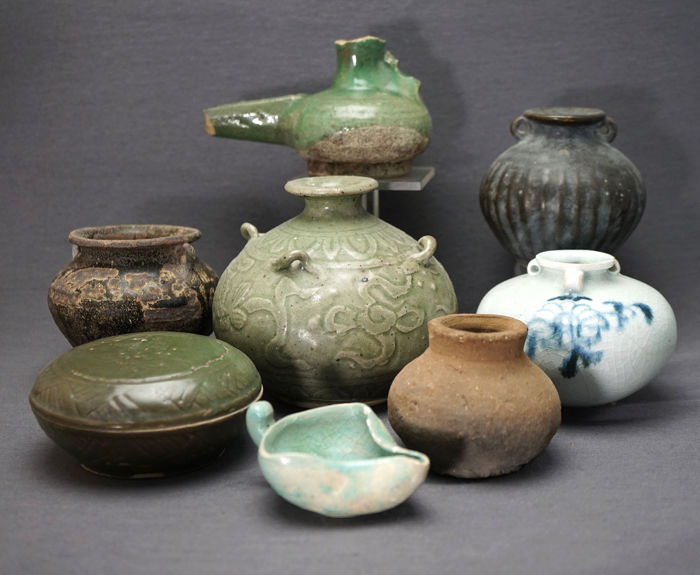 A collection of stonewear pots